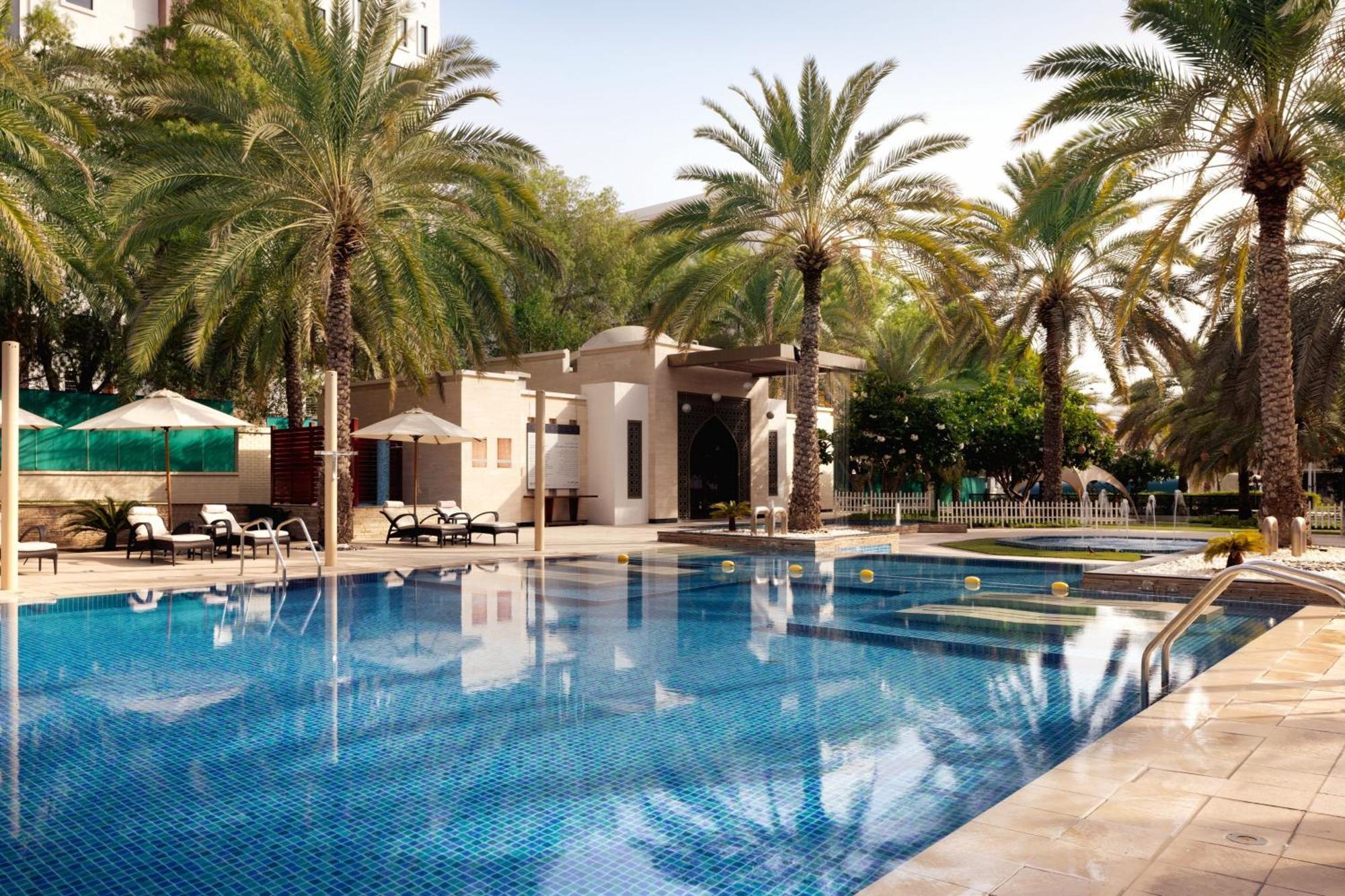 Sheraton Oman Hotel Muscat Exterior photo The swimming pool at the Jumeirah Creekside