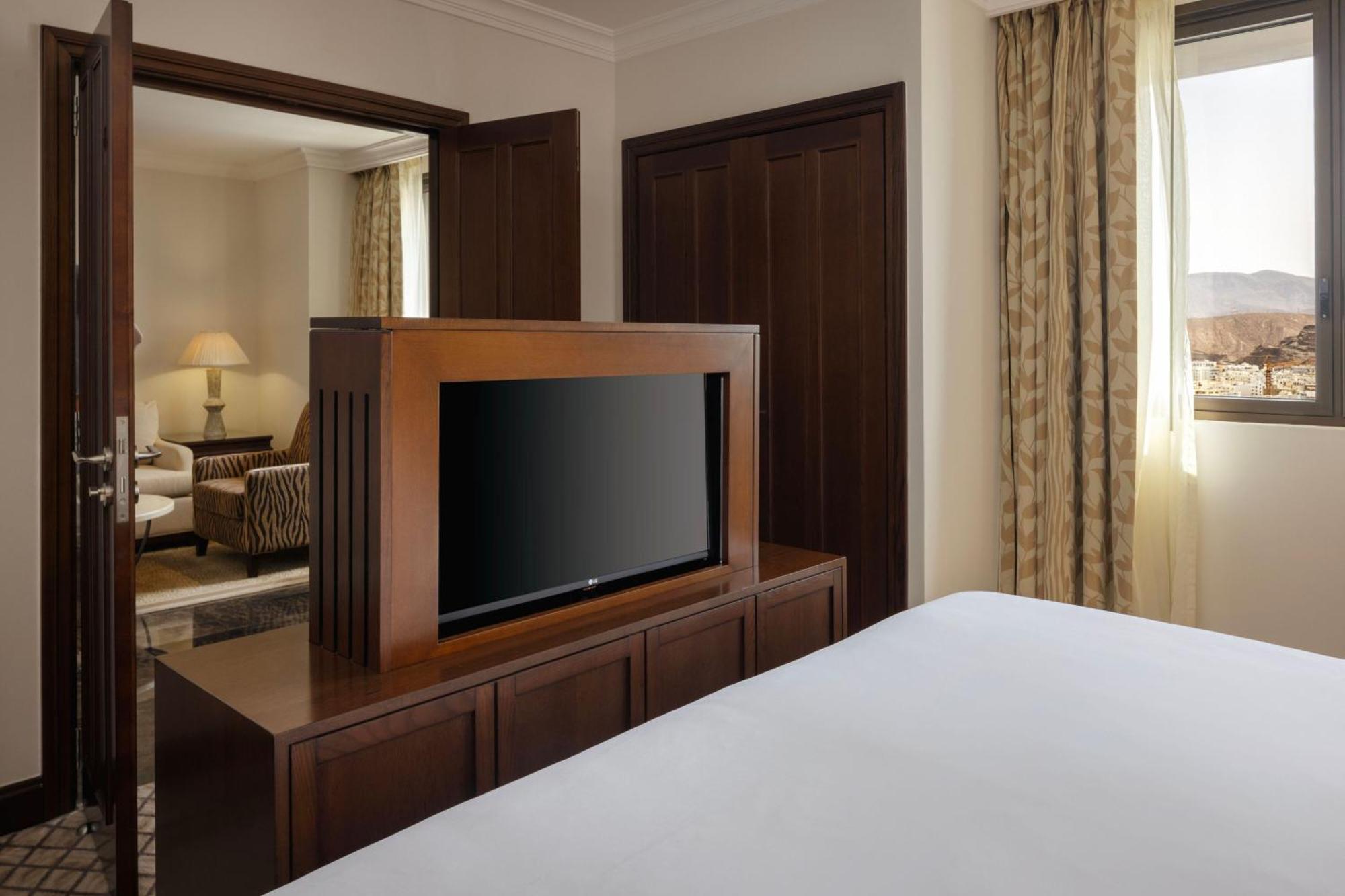 Sheraton Oman Hotel Muscat Exterior photo A television in a hotel room